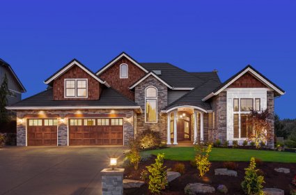 front exterior of luxury home in evening