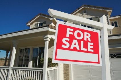 Sold Home For Sale Sign in Front of New House